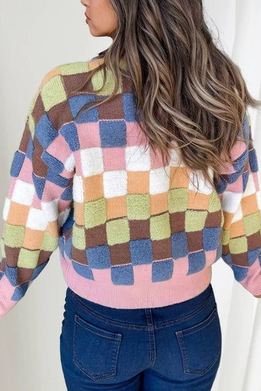Women’s colorful checkered cardigan sweater with pink trim and button front – cozy fall fashion.